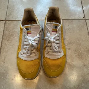 Men’s Adidas ZX 500 RM shoes in yellow.