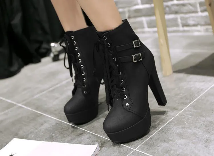 The patent leather block heel ankle boot.
