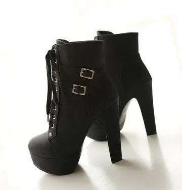 The patent leather block heel ankle boot.